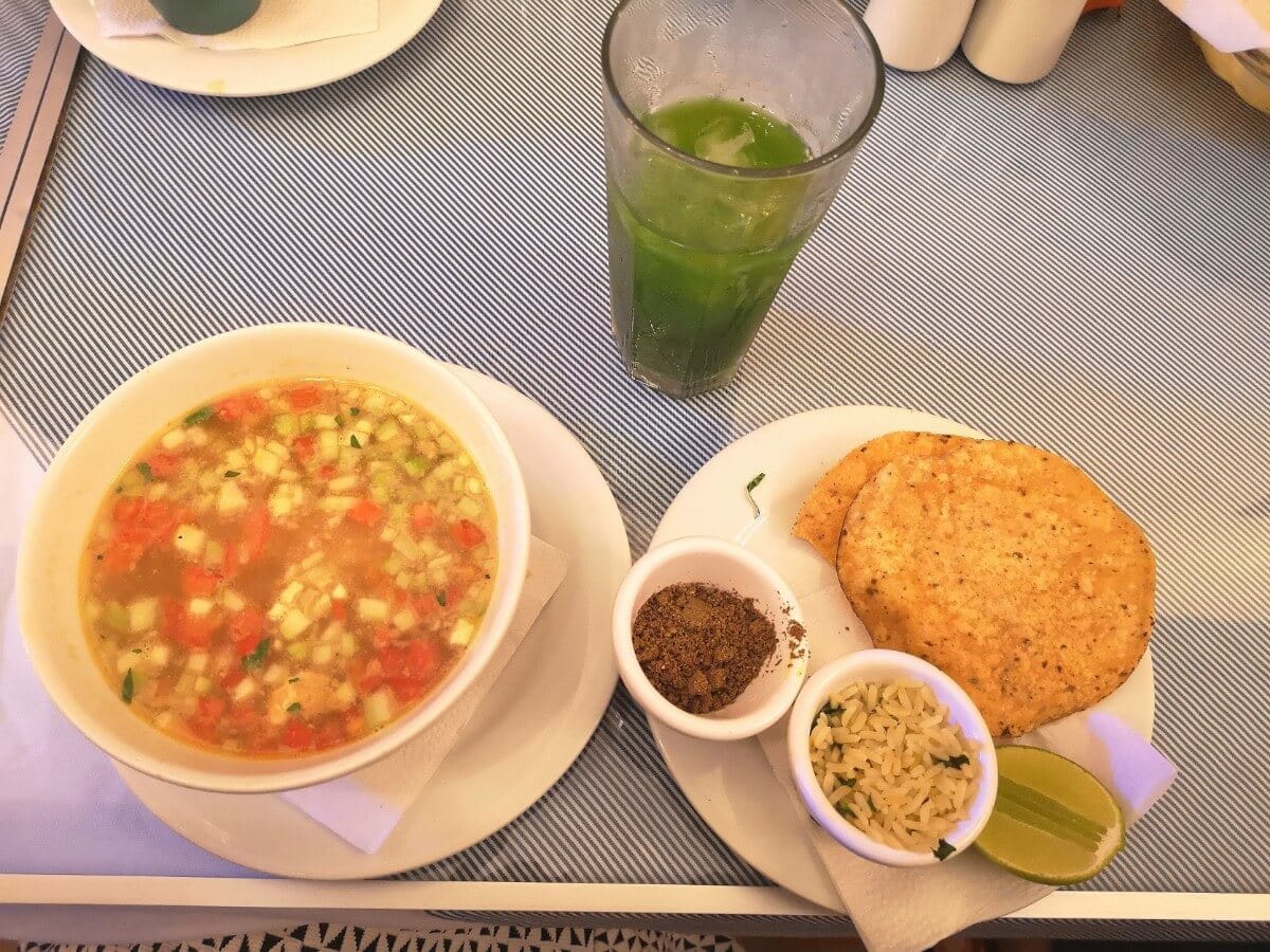 green chaya drink with traditional yucatan food