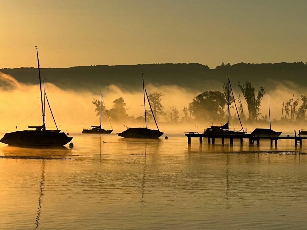 boats on Lake Ammersee in the sunset